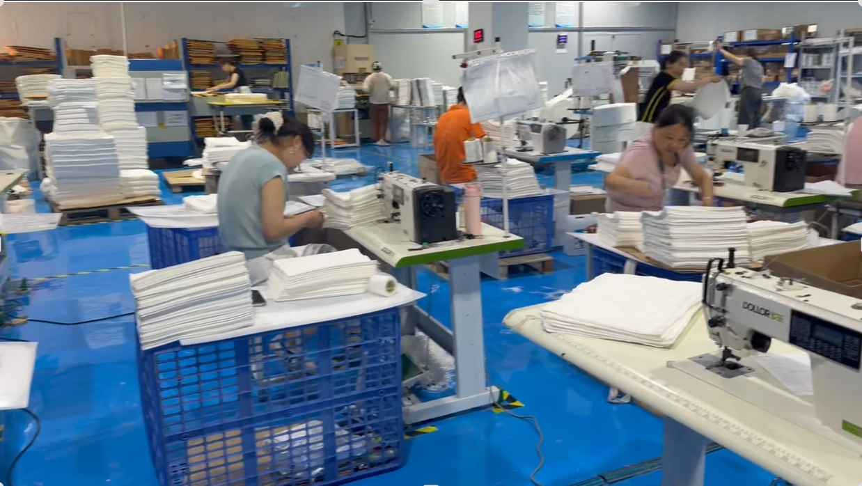 alt="Custom sewing process for compostable bamboo fiber bags for brand packaging needs"