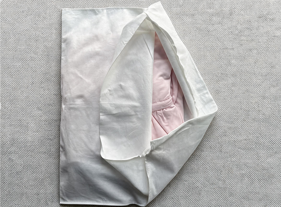 alt="Bamboo Fiber Compostable Fold-Over Dust Bag for Luxury Apparel Packaging and Storage with Dust and Stain Protection"