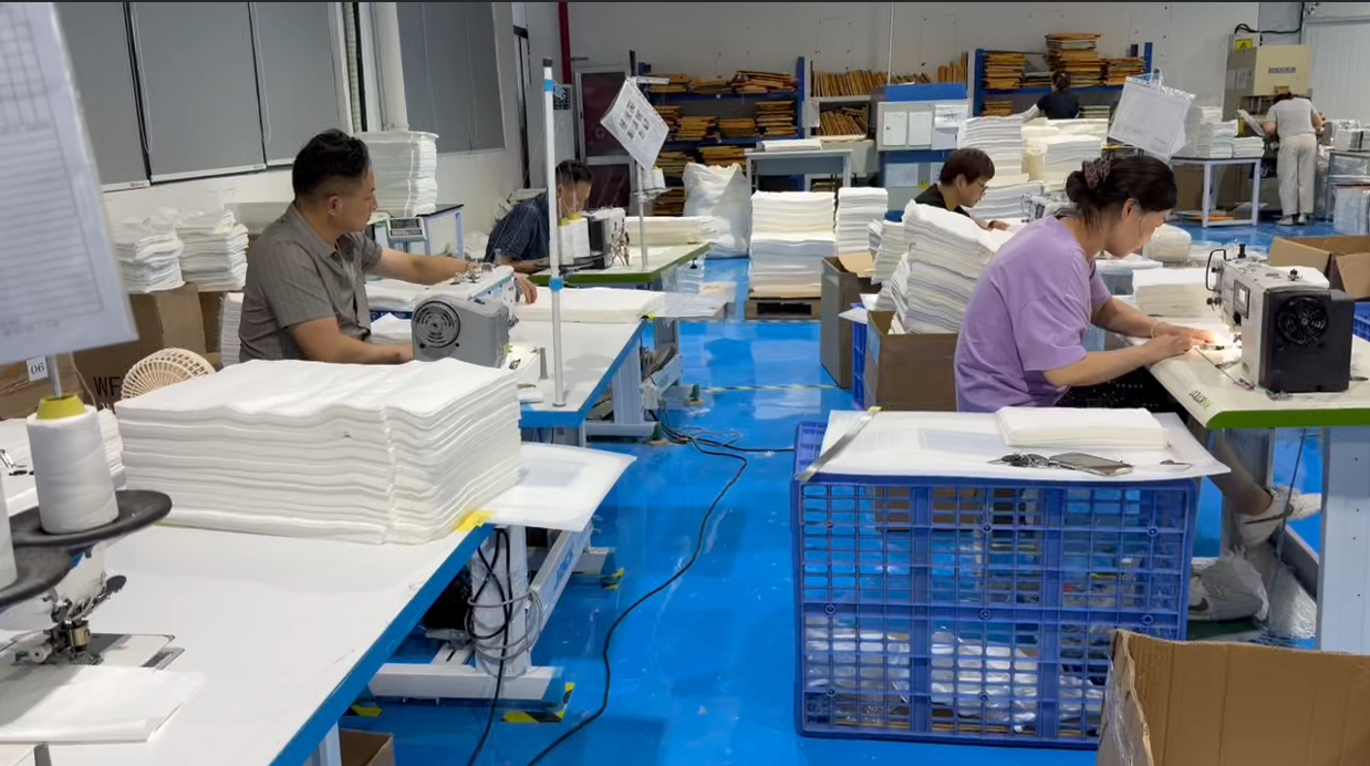 alt="Hand Sewing Process in Bamboo Fiber Compostable Bag Manufacturing"