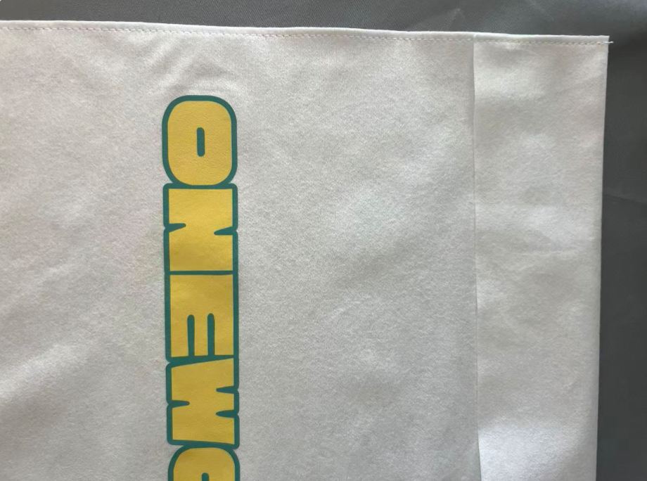 alt="Compostable Bamboo Fiber Fold-Over Bag for Luxury Shoe and Apparel Packaging"